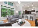 Bright open living space with large windows, hardwood floors, and modern furnishings at 1903 Anjaco Rd # 5, Atlanta, GA 30309