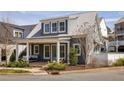 Charming exterior view of home with inviting porch, landscaping, and a metal roof at 240 Mado Ln, Chattahoochee Hills, GA 30268