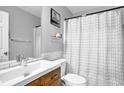 Clean bathroom with white subway tile, updated vanity, modern fixtures, and a patterned shower curtain at 3000 Storybook Ln, Grayson, GA 30017