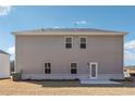 Back exterior of home with simple lines and an enclosed backyard at 345 Orwell Dr, Social Circle, GA 30025
