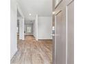 View of a freshly painted entryway of a new home with light-colored wood floors at 345 Orwell Dr, Social Circle, GA 30025