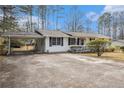 Ranch style home with a car port and a well-maintained front yard at 640 Maple Dr, Riverdale, GA 30274