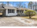 Ranch style home featuring a car port and a well-maintained front yard at 640 Maple Dr, Riverdale, GA 30274