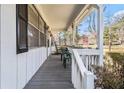 Inviting front porch with rocking chairs, perfect for relaxing and enjoying the outdoors at 640 Maple Dr, Riverdale, GA 30274