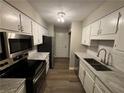 A well-equipped kitchen with stainless steel appliances and subway tile backsplash at 2992 Parc Lorraine, Lithonia, GA 30038