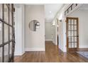 Bright foyer with hardwood floors, elegant trim, and a view of the dining room at 3207 Kensington Rd, Avondale Estates, GA 30002