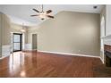 Open living area featuring hardwood floors, a ceiling fan, and ample space at 1850 Westwind Dr, Cumming, GA 30041