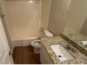 Bright bathroom featuring a shower and granite countertops at 1815 Boulderview Se Dr, Atlanta, GA 30316