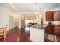 Inviting living room with hardwood floors seamlessly connected to the kitchen, providing an open and airy atmosphere at 200 River Vista Dr # 736, Atlanta, GA 30339