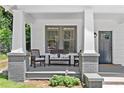 Inviting front porch with comfortable seating, columns, and classic craftsman details at 370 Sydney Se St, Atlanta, GA 30312