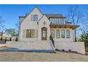 Charming home with a brick exterior, manicured lawn, and inviting front entrance at 375 Chattahoochee St, Roswell, GA 30075