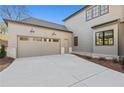 Spacious two-car garage with a wide driveway and neutral siding, providing ample parking at 375 Chattahoochee St, Roswell, GA 30075