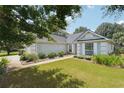 A charming home is complemented by well-maintained landscaping and lush green lawn at 3861 Rivers Run Nw Trce, Acworth, GA 30101
