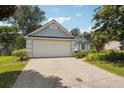 Inviting one-story home featuring an attached garage, complemented by a front yard at 3861 Rivers Run Nw Trce, Acworth, GA 30101