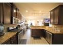 Modern kitchen featuring stainless steel appliances, granite countertops, and an open design to the living areas at 9348 Lantana Trl, Jonesboro, GA 30238