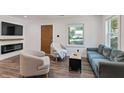 Comfortable living room with modern furniture, fireplace, and ample natural light at 1377 Marston St, Smyrna, GA 30080