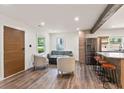 Cozy living room with modern decor, wooden accents, hardwood floors and plenty of natural light at 1377 Marston St, Smyrna, GA 30080