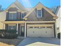 Attractive brick facade with a two-car garage and inviting entrance at 2478 Brynfield Cv, Suwanee, GA 30024