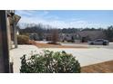 Street view of neighborhood with sidewalks and well-kept homes, providing a suburban feel at 1986 Villa Spring Ct, Dacula, GA 30019