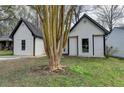 Charming one story home with white siding, black trim, and grass at 5393 Ridge Forest Dr, Stone Mountain, GA 30083