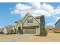 Attractive two-story home featuring neutral siding, stone accents, and a two-car garage at 3255 Blackburn Dr, Cumming, GA 30040