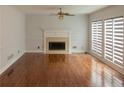 Spacious living room with hardwood floors, fireplace, and lots of natural light at 5150 Rockford Ln, Stockbridge, GA 30281