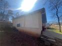 Attached carport featuring a red vehicle at 5744 Amalfi Way, Douglasville, GA 30135