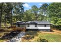 Beautiful exterior view of home with a covered porch and fresh landscaping at 4739 Cook Sw Rd, Stockbridge, GA 30281