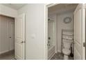 Bright bathroom featuring a combo shower and tub, offering a clean and functional space at 4825 Layton Drive, Lithia Springs, GA 30122