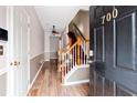 Inviting entryway with wood-look tile flooring and staircase at 700 Celeste Sw Ln, Atlanta, GA 30331