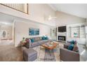 Bright, staged living room featuring a fireplace, built-in shelving, and soaring ceilings at 101 Hardwood Ln, Canton, GA 30115