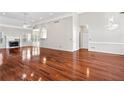 Open living room with hardwood floors, fireplace, crown moulding, and natural light at 2304 New Haven Pl, Conyers, GA 30094
