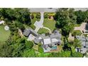 Aerial view of an estate featuring a large home, pool, manicured grounds, and circular driveway at 4520 Garmon Nw Rd, Atlanta, GA 30327