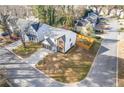 Aerial view of a two-story home, showcasing its landscaping and neighborhood at 1074 Wenham Ln, Lawrenceville, GA 30044