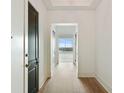 Bright hallway features light wood floors, white walls, and views of the city, creating a welcoming atmosphere at 3630 Peachtree Ne Rd # 3302, Atlanta, GA 30326