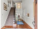 Grand foyer with hardwood floors, staircase, elegant decor, and ample natural light at 3720 Harts Pl, Atlanta, GA 30341