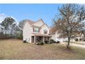 Charming two-story home on a spacious lot featuring an attached two car garage and manicured landscaping at 345 Timberlake Ter, Covington, GA 30016