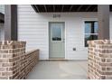 Inviting front door featuring brick accents and modern design at 2219 Nena Way # 22, Tucker, GA 30084