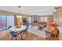 Inviting living room features a stone fireplace, wood floors, and ample natural light at 3916 Loch Highland Ne Pass, Roswell, GA 30075