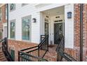 Charming townhome entrance featuring brick stairs and classic exterior design at 531 Burton Dr, Alpharetta, GA 30009