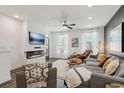 Bright living room featuring a modern fireplace, large windows, and stylish furnishings at 531 Burton Dr, Alpharetta, GA 30009