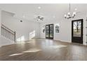 Bright living room with wood floors, large windows, and modern ceiling fan at 937 Willingham Dr # 7, Hapeville, GA 30354
