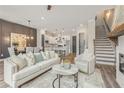 Bright, open-concept living room with modern finishes and seamless flow to kitchen at 941 Willingham Dr # 5, Hapeville, GA 30354