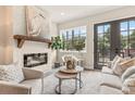 Cozy living room with fireplace, abundant natural light, and stylish decor at 941 Willingham Dr # 5, Hapeville, GA 30354