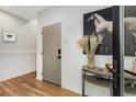 Entryway features hardwood floors, white walls, a console table with decor, and a horse portrait above it at 219 Howell Se Dr # A, Atlanta, GA 30316