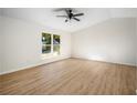 Bright bedroom featuring a large window and vaulted ceilings at 5541 Downs Way, Lithonia, GA 30058