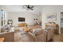 Spacious living room with vaulted ceiling, hardwood floors, and dining area at 5541 Downs Way, Lithonia, GA 30058