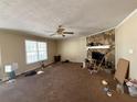 Spacious living room with a stone fireplace and a large window, perfect for gatherings at 430 N Oakland Cir, Mcdonough, GA 30253