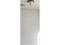 A close up of a white ceiling with a light fixture and an air vent at 5626 Pine Gate Dr, Atlanta, GA 30349