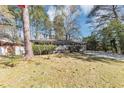 Well-maintained single-story home with a front lawn, shrubbery, and a paved driveway at 2754 Drew Valley Ne Rd, Atlanta, GA 30319